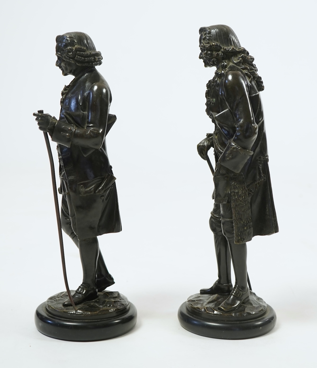 After Jean-Claude-Joseph Rosset (1706-1786), two patinated bronze figures of Voltaire and Jean-Jacques Rousseau, 19th century